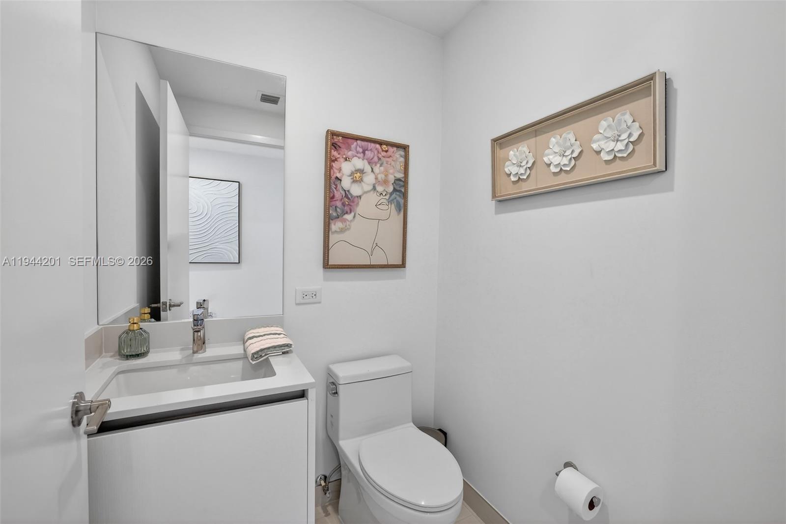 900 North Ocean Boulevard, Unit 906 Pompano Beach, FL 33062 - Photo 31 of 100 Powder Room near foyer entrance