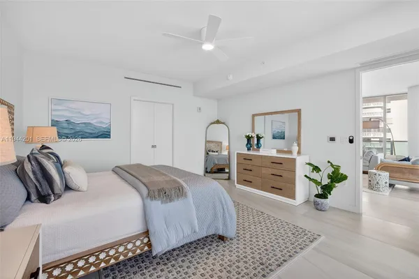 a bathroom with a granite countertop sink toilet a mirror and shower