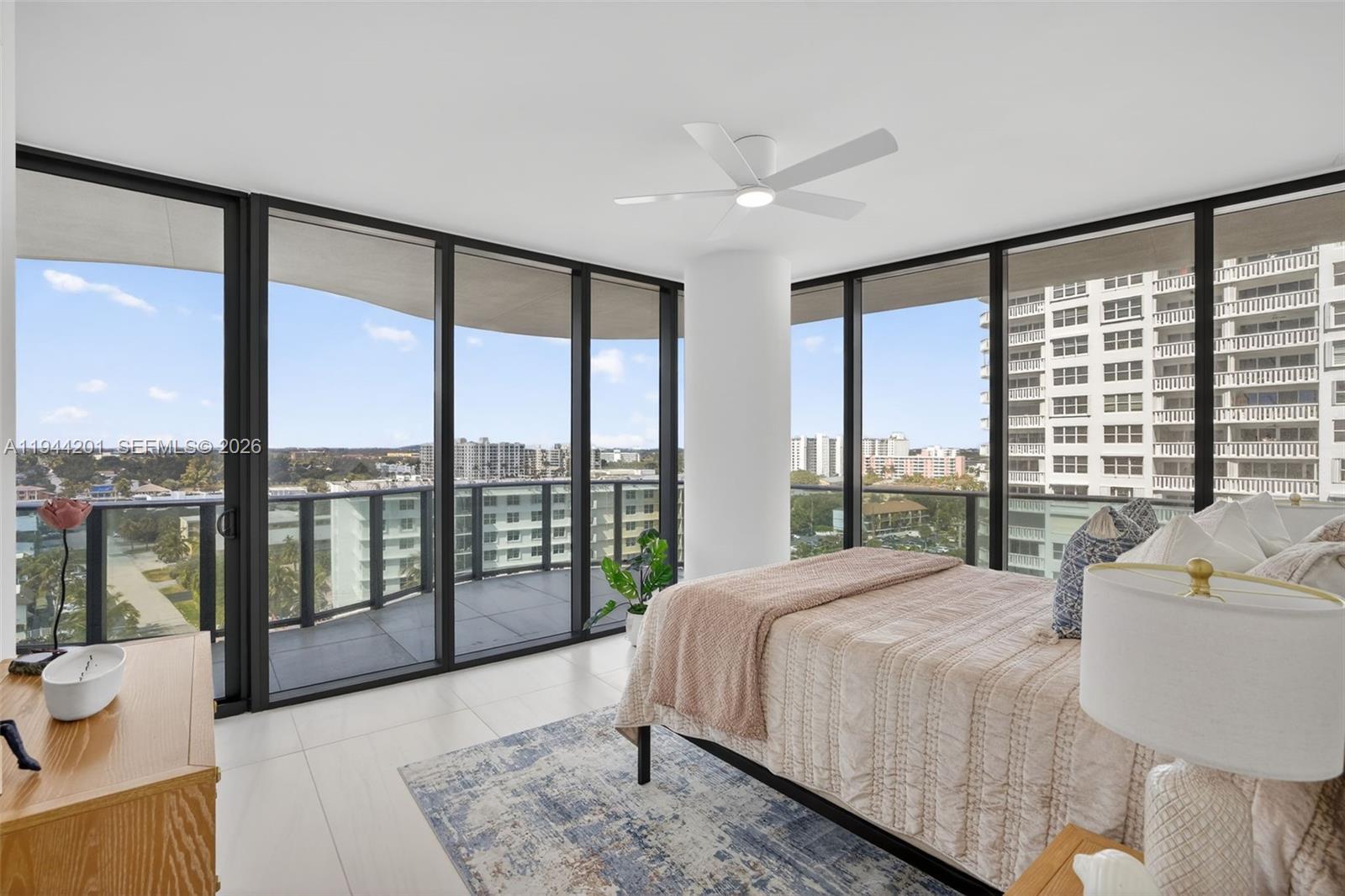 900 North Ocean Boulevard, Unit 906 Pompano Beach, FL 33062 - Photo 50 of 100 Guest Bedroom #2 - ensuite bathroom w/ walk in closet, w/ sliders w/ wrap around balcony and views to the west and north