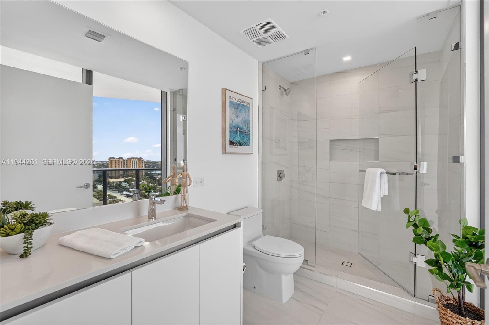 900 North Ocean Boulevard, Unit 906 Pompano Beach, FL 33062 - Photo 53 of 100 Guest Bathroom #2 with shower w/ frameless glass enclosure