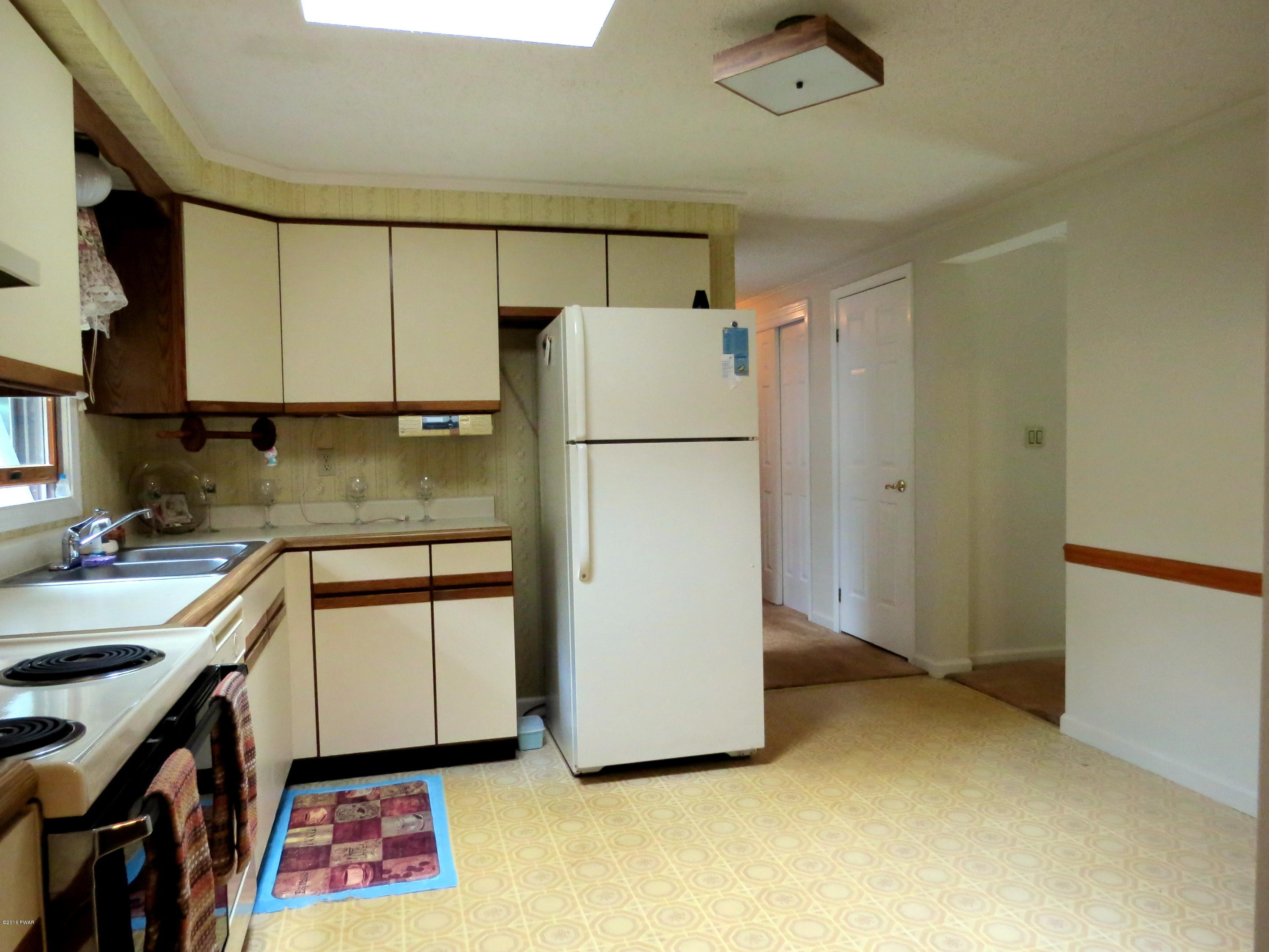 124 Pine Road Hawley, PA 18428 - Photo 10 of 46 kitchen to hall