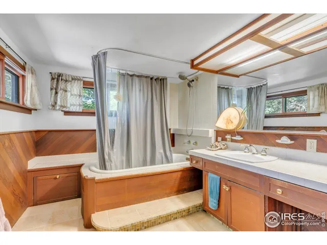 a bathroom with a sink double vanity and a mirror