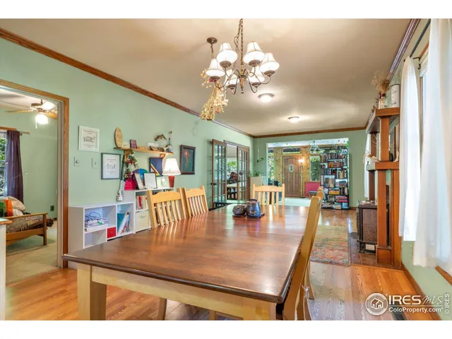 a view of a dining room with furniture and a livingroom