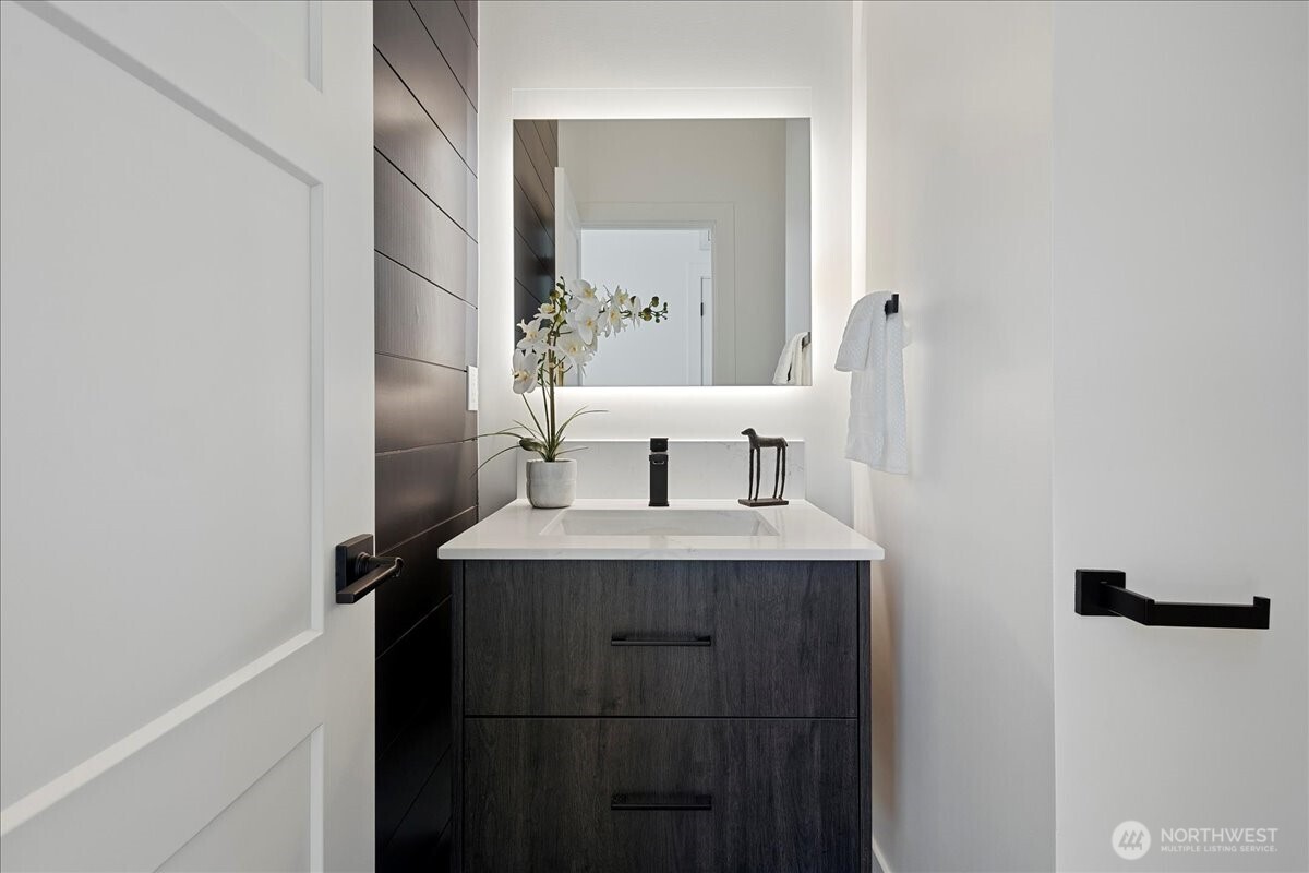 208 Skipping Stone Loop Lynden, WA 98264 - Photo 12 of 28 a view of bathroom with a sink and a mirror