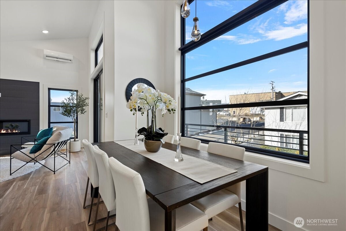 208 Skipping Stone Loop Lynden, WA 98264 - Photo 10 of 28 a view of a dining room with furniture window and wooden floor