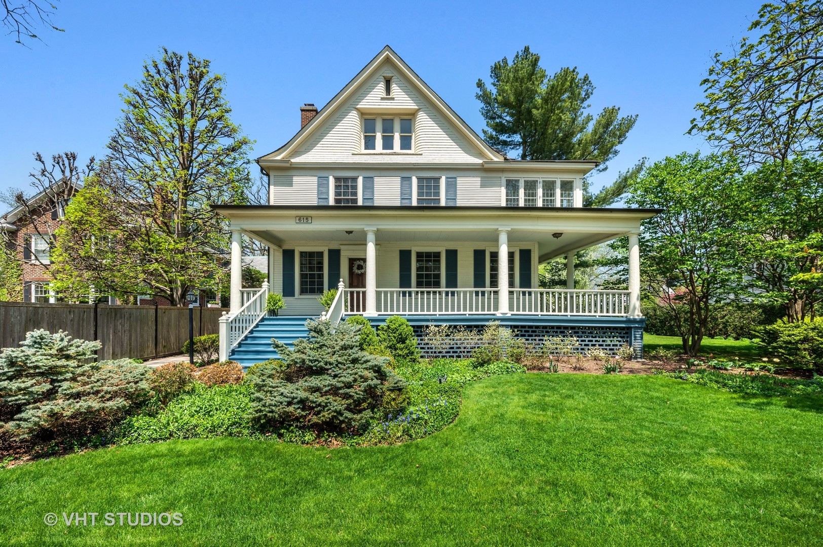 615 Elm Street Winnetka, IL 60093 - Photo 1 of 43 a house with green field in front of it