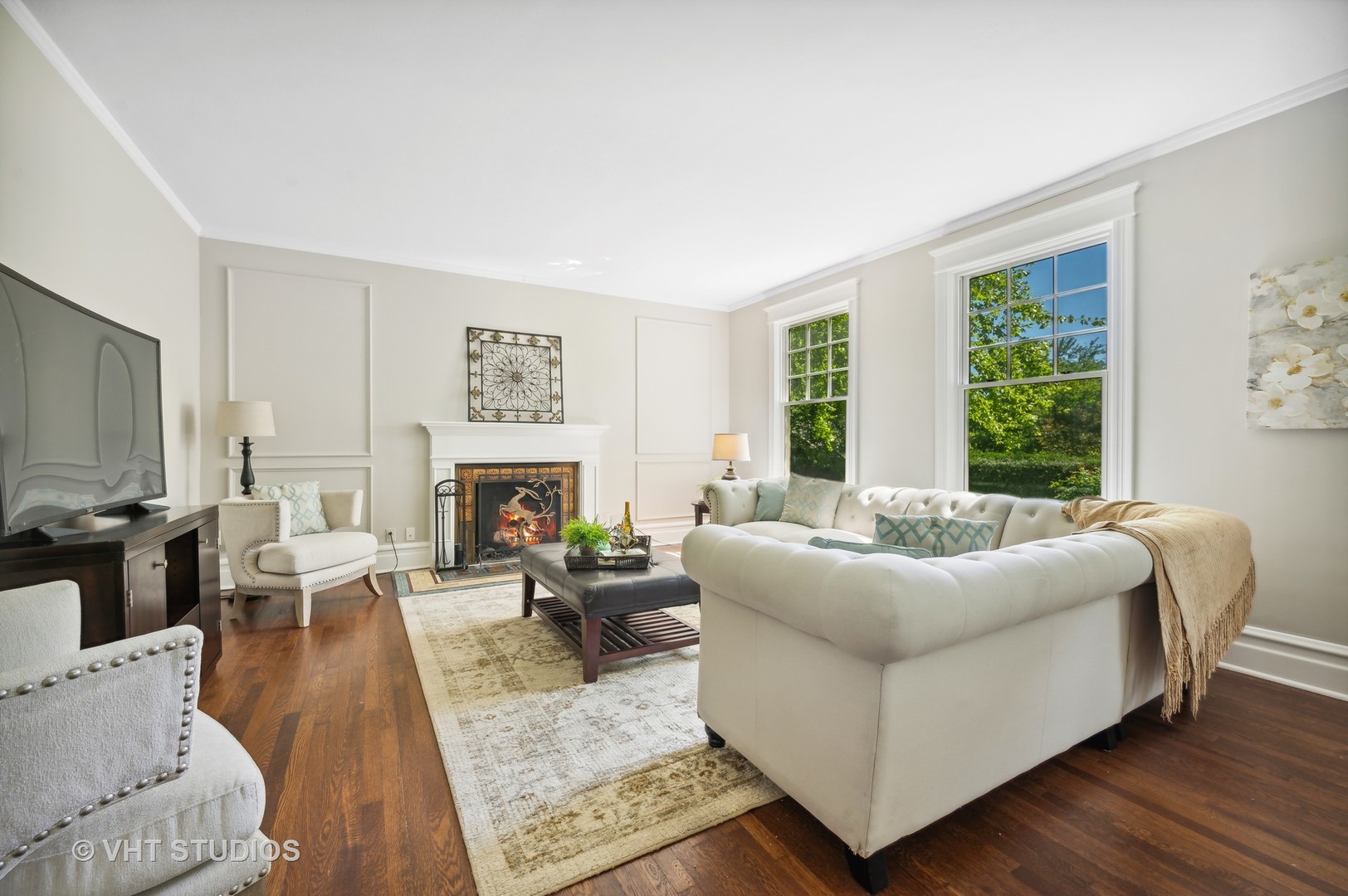 615 Elm Street Winnetka, IL 60093 - Photo 12 of 43 a living room with furniture large window and a fireplace
