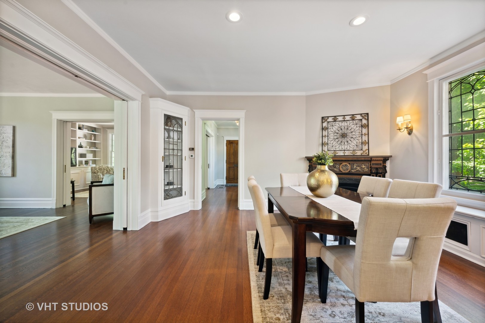 615 Elm Street Winnetka, IL 60093 - Photo 14 of 43 a view of a dining room with furniture and wooden floor