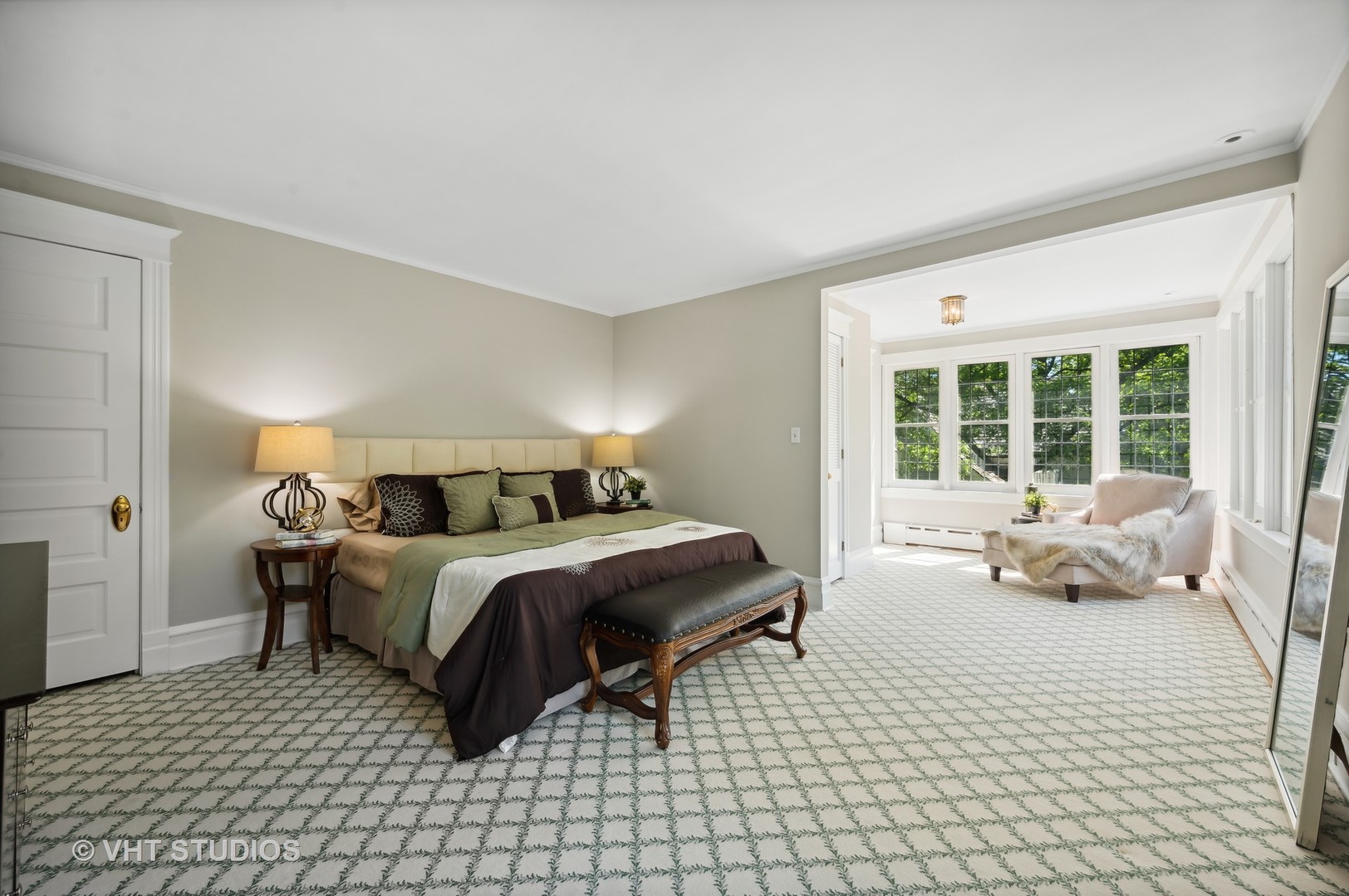 615 Elm Street Winnetka, IL 60093 - Photo 17 of 43 a spacious bedroom with a bed and a couch