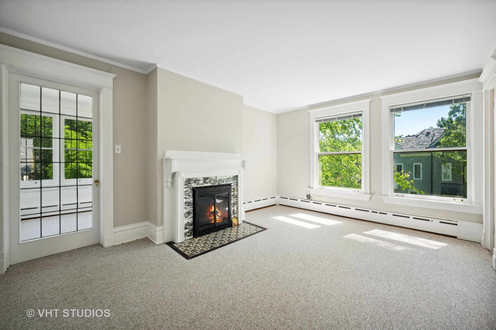 615 Elm Street Winnetka, IL 60093 - Photo 19 of 43 a view of a livingroom with a fireplace and window
