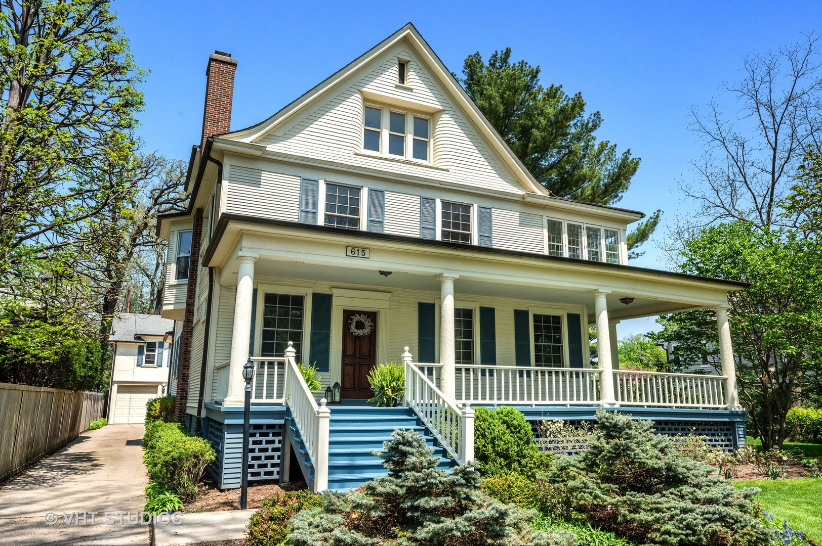615 Elm Street Winnetka, IL 60093 - Photo 2 of 43 front view of a house with a small yard