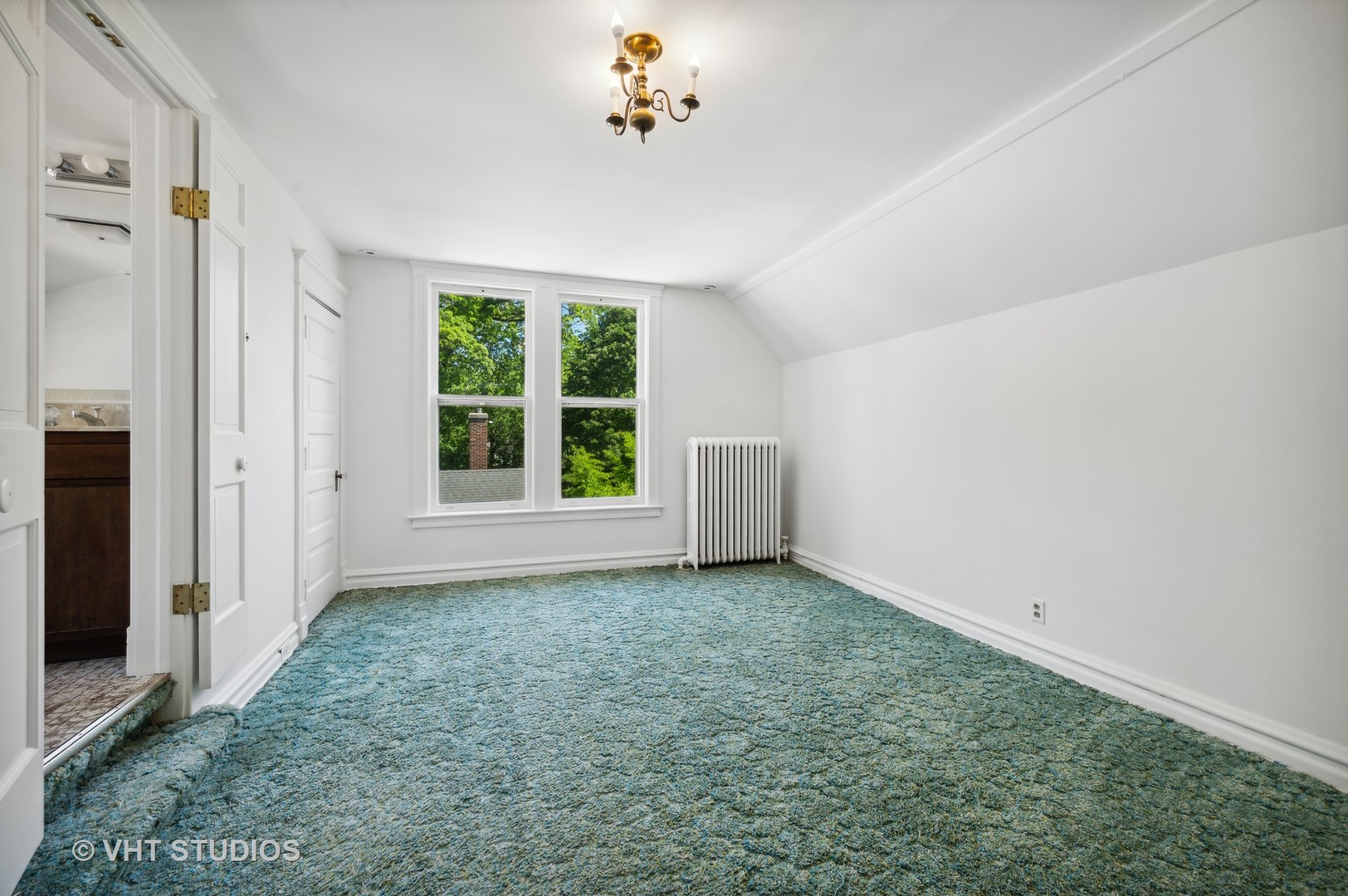 615 Elm Street Winnetka, IL 60093 - Photo 22 of 43 a view of an empty room with a window