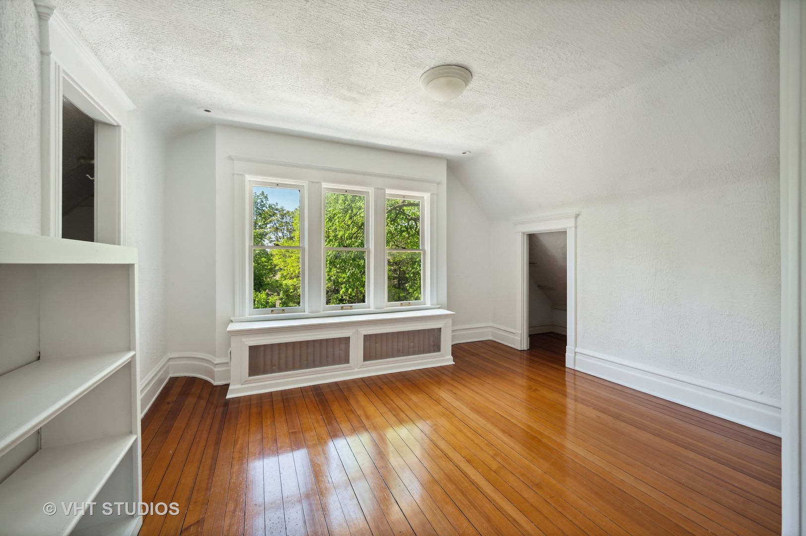 615 Elm Street Winnetka, IL 60093 - Photo 24 of 43 wooden floor in an empty room with a window