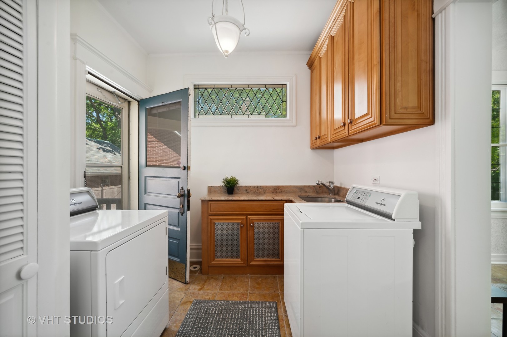 615 Elm Street Winnetka, IL 60093 - Photo 27 of 43 a utility room with sink dryer and washer