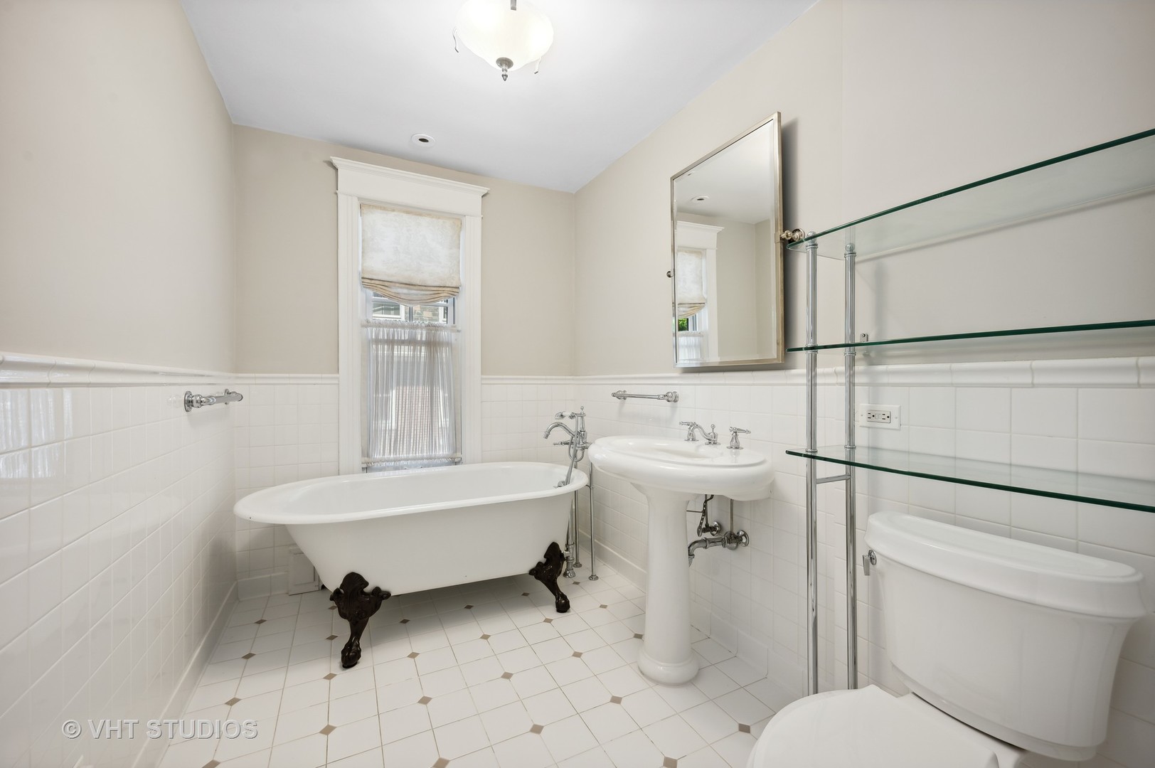 615 Elm Street Winnetka, IL 60093 - Photo 29 of 43 a bathroom with a sink toilet tub and shower