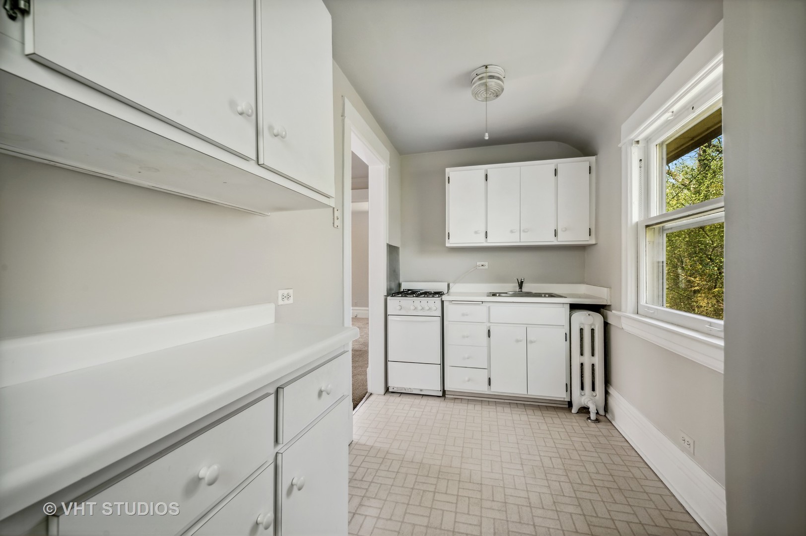 615 Elm Street Winnetka, IL 60093 - Photo 35 of 43 a utility room with cabinets washer and dryer