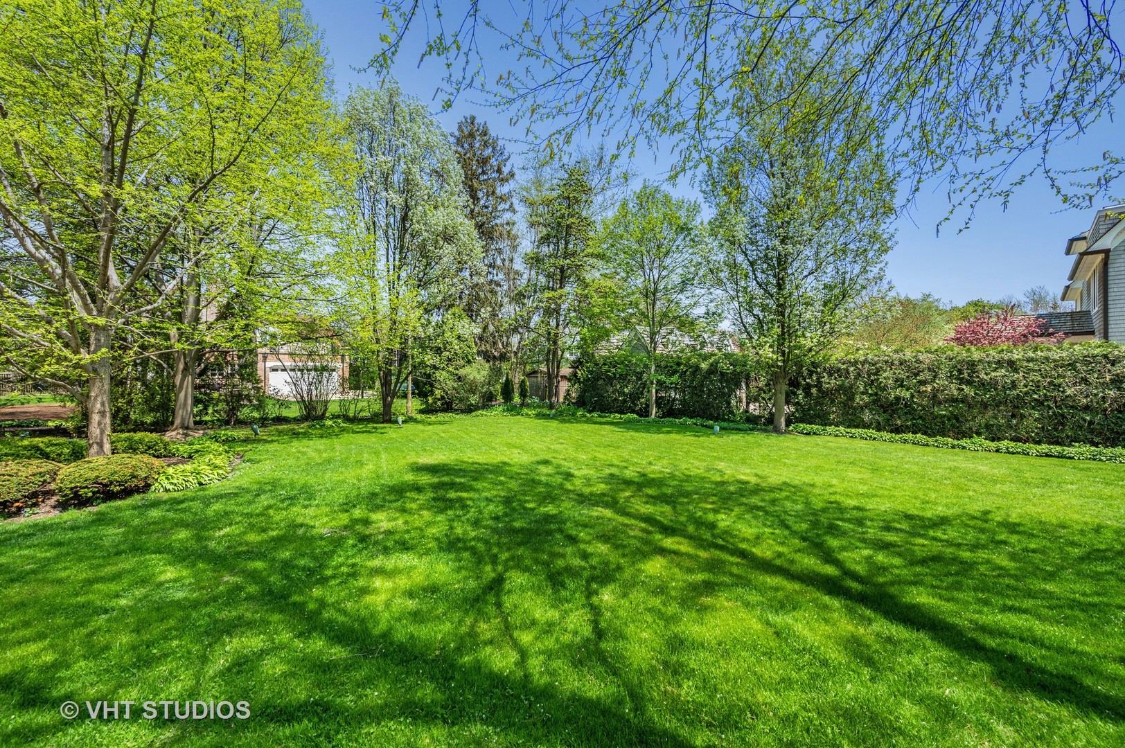 615 Elm Street Winnetka, IL 60093 - Photo 5 of 43 a view of a backyard with a garden
