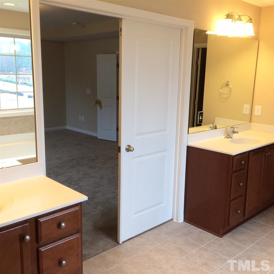 7649 Channery Way Raleigh, NC 27616 - Photo 15 of 25 cultured marble counter tops and separate vanities are ideal for you folks. Master Bedroom
