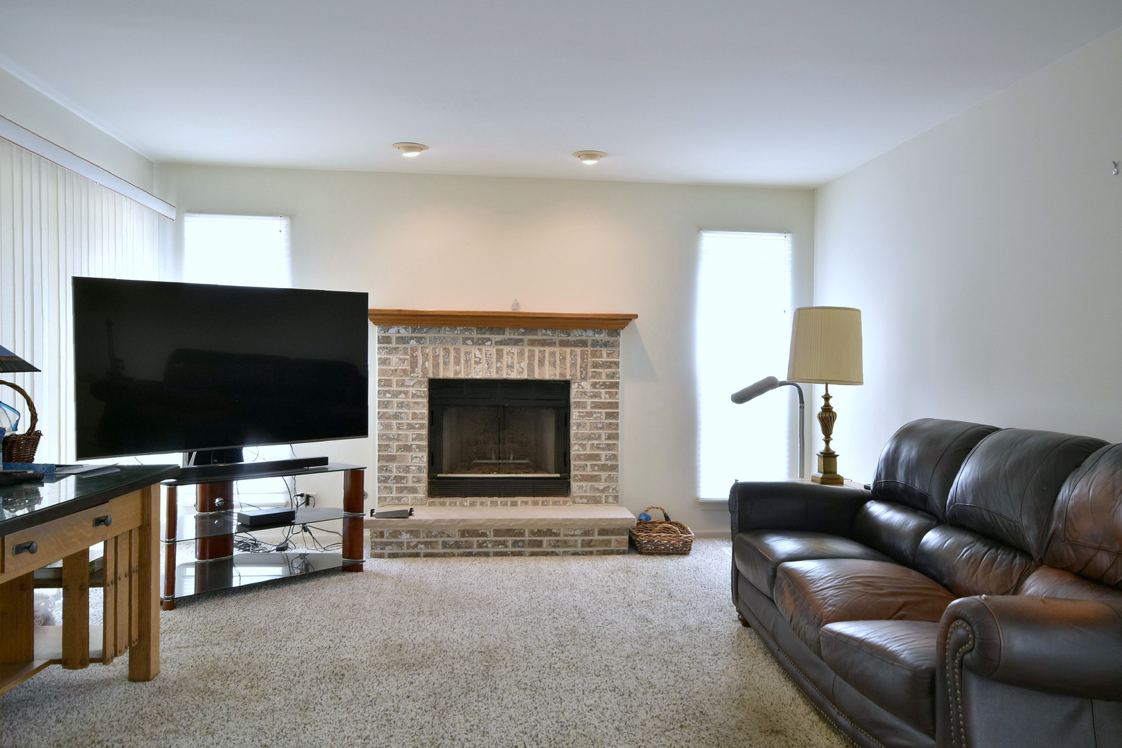1741 Crofton Drive Algonquin, IL 60102 - Photo 12 of 32 a living room with furniture and a flat screen tv