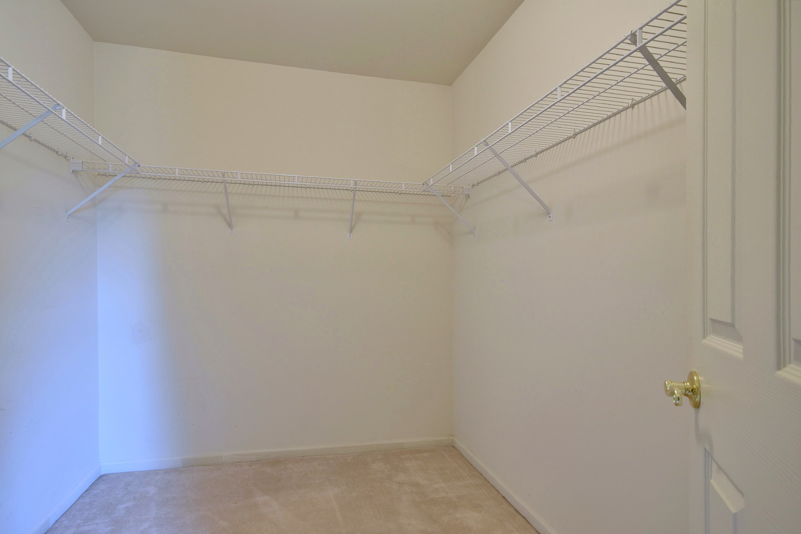 1741 Crofton Drive Algonquin, IL 60102 - Photo 22 of 32 a view of a room with racks on the wall