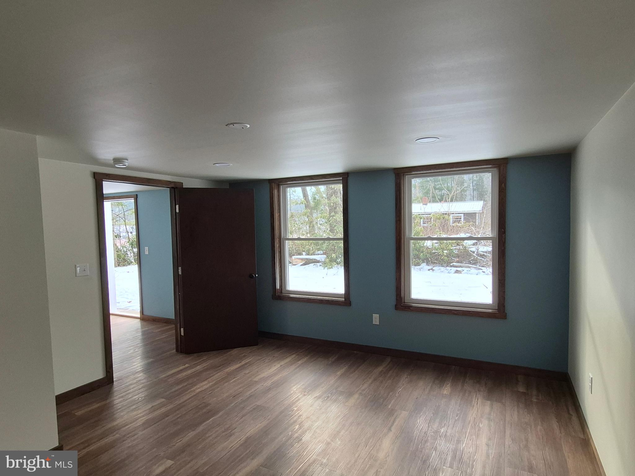 7144 Renovo Road Mill Hall, PA 17751 - Photo 16 of 27 a view of an empty room with wooden floor and a window