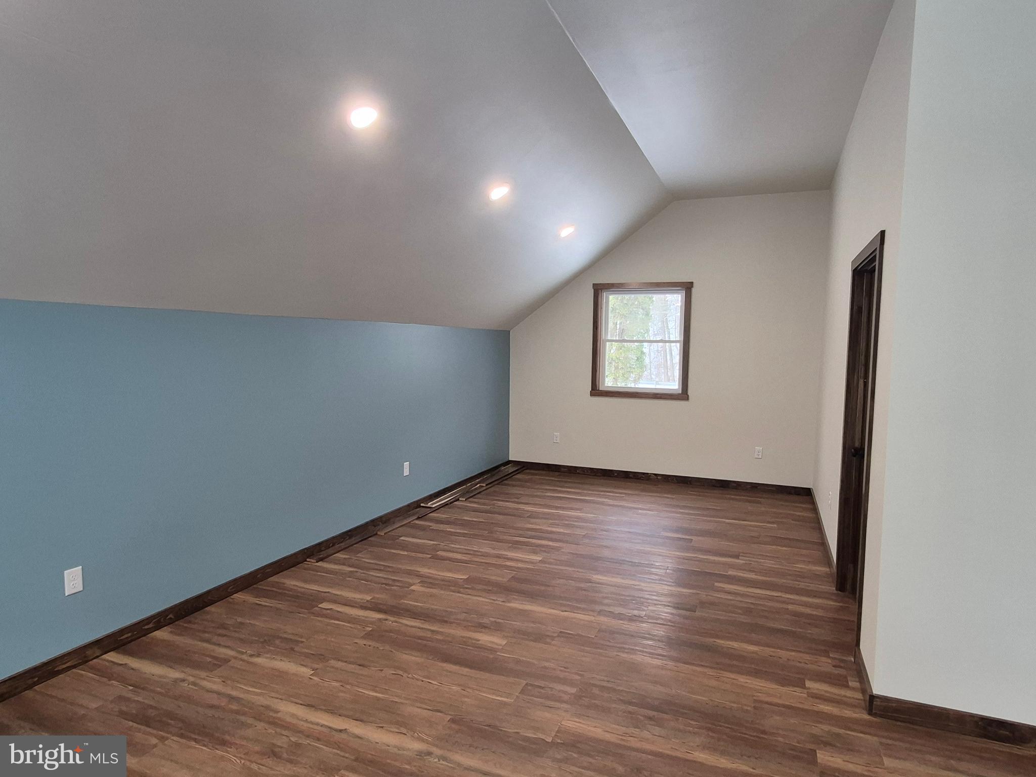 7144 Renovo Road Mill Hall, PA 17751 - Photo 18 of 27 an empty room with wooden floor and windows