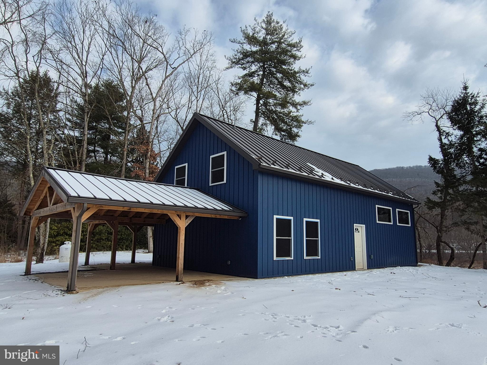 7144 Renovo Road Mill Hall, PA 17751 - Photo 2 of 27 a front view of house with yard and trees in the background