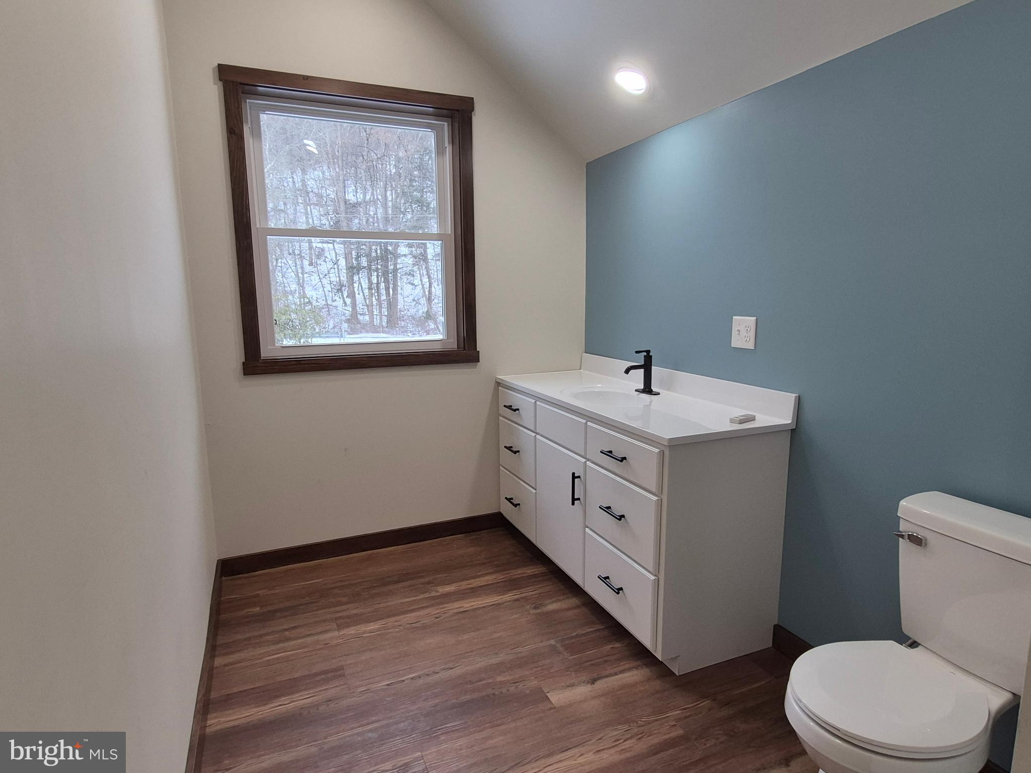 7144 Renovo Road Mill Hall, PA 17751 - Photo 23 of 27 a bathroom with a toilet sink and mirror