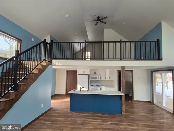 a view of staircase with a black white checkered floor