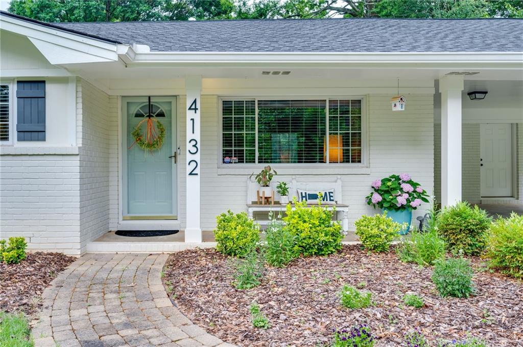 4132 North Shallowford Road Chamblee, GA 30341 - Photo 1 of 1 a front view of a house with garden