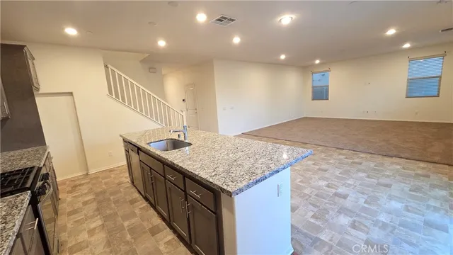 a view of an empty room and a window
