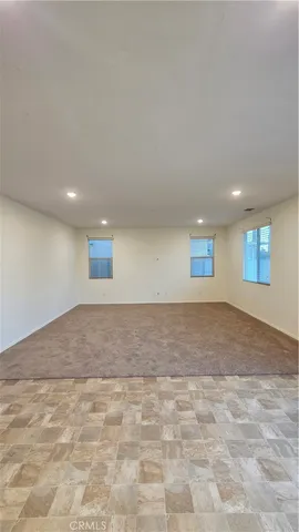a view of an empty room and closet area