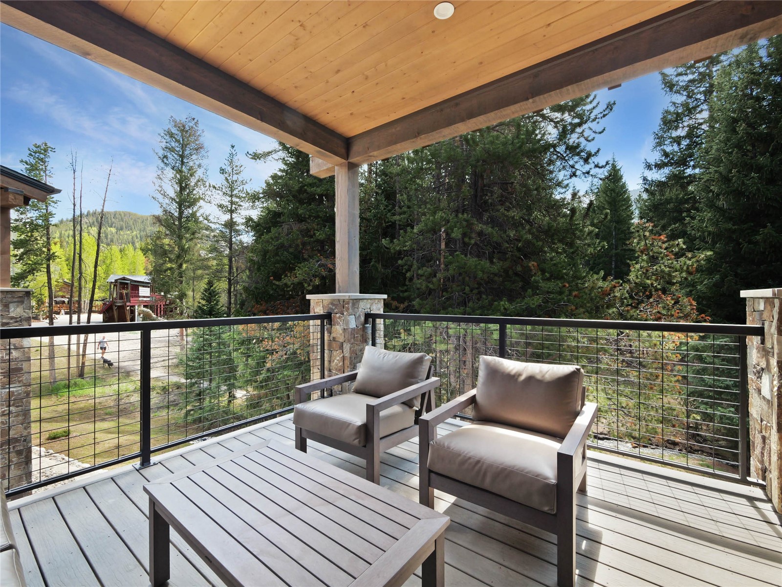 75 Alcove Court, Unit 75 Keystone, CO 80435 - Photo 27 of 40 a balcony with wooden floor table and chairs