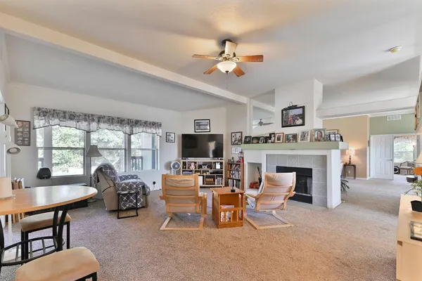 a view of a livingroom with furniture and a dining table