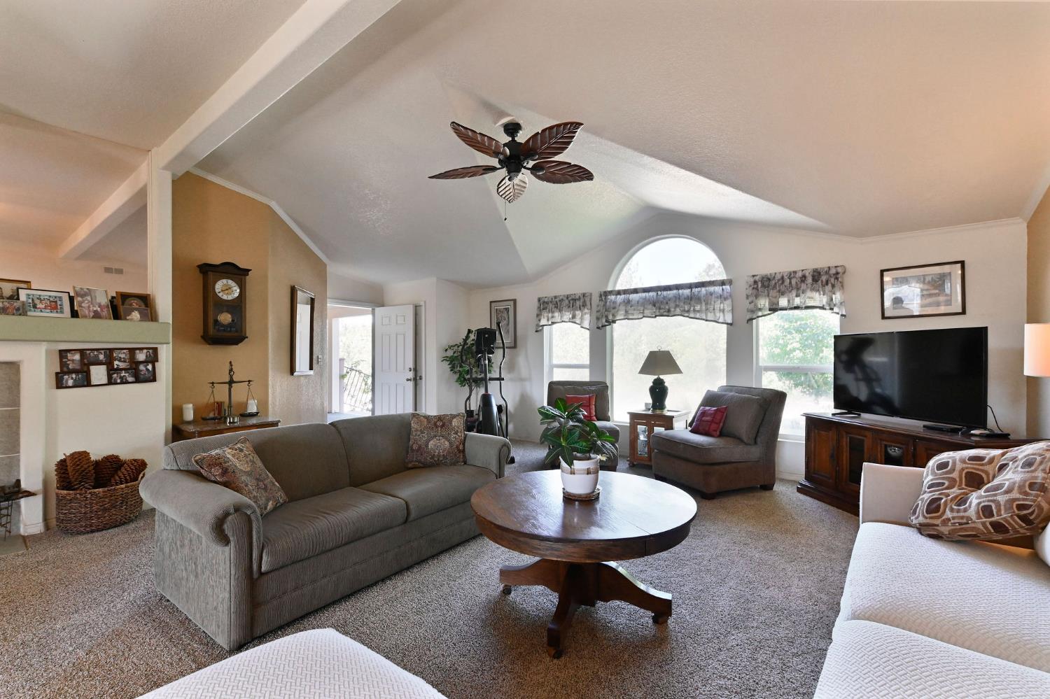 3770 Sheep Ranch Road Murphys, CA 95247 - Photo 10 of 92 a living room with furniture a fireplace and a large window