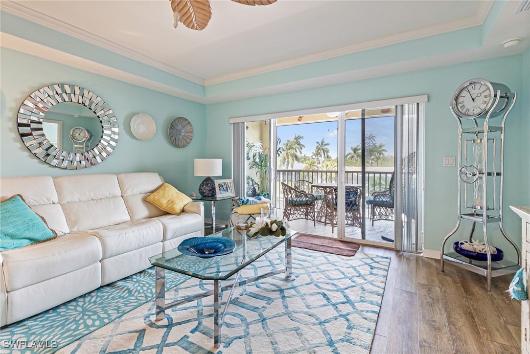 1799 Four Mile Cove Parkway, Unit 925 Cape Coral, FL 33990 - Photo 14 of 49 a living room with furniture and a large window