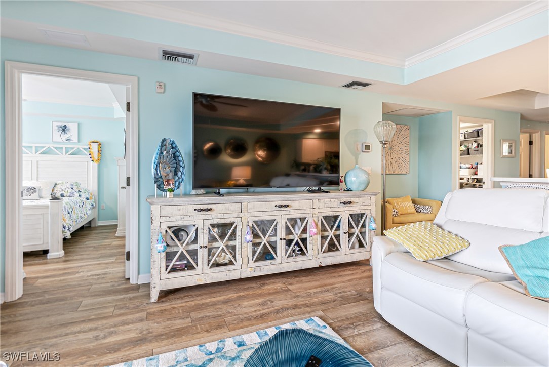1799 Four Mile Cove Parkway, Unit 925 Cape Coral, FL 33990 - Photo 16 of 49 a living room with furniture and a flat screen tv