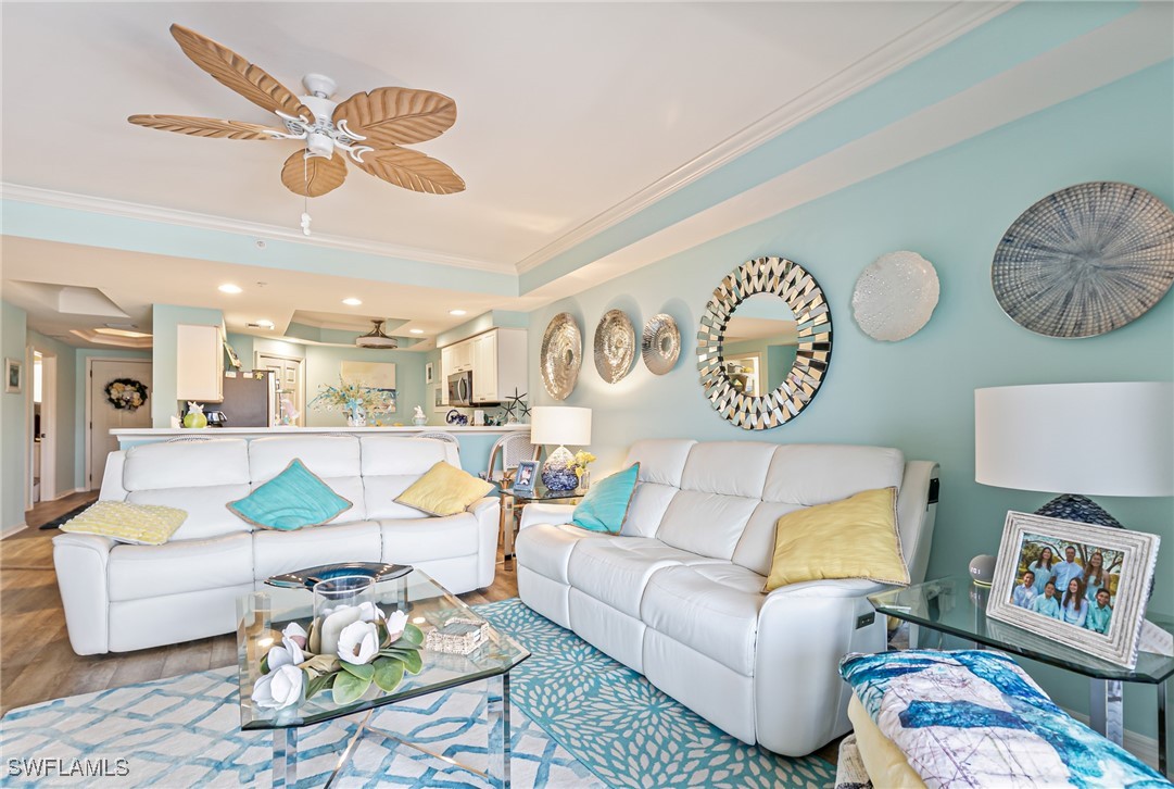 1799 Four Mile Cove Parkway, Unit 925 Cape Coral, FL 33990 - Photo 18 of 49 a living room with furniture and a table