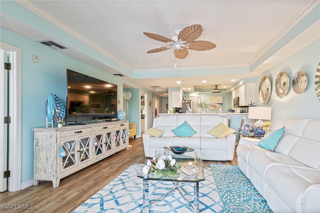 1799 Four Mile Cove Parkway, Unit 925 Cape Coral, FL 33990 - Photo 20 of 49 a living room with furniture and a flat screen tv
