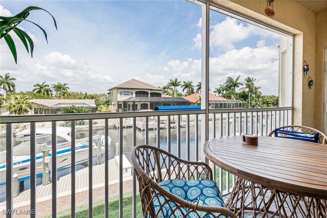 1799 Four Mile Cove Parkway, Unit 925 Cape Coral, FL 33990 - Photo 24 of 49 a view of a balcony with an outdoor seating
