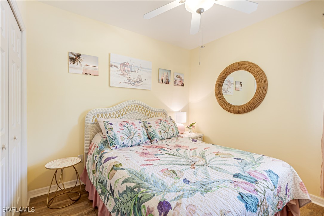 1799 Four Mile Cove Parkway, Unit 925 Cape Coral, FL 33990 - Photo 26 of 49 a bedroom with a bed and a wall painting