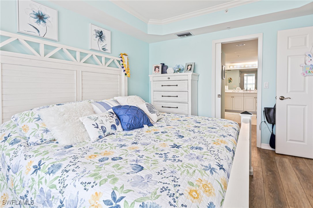 1799 Four Mile Cove Parkway, Unit 925 Cape Coral, FL 33990 - Photo 29 of 49 a bedroom with a bed and a dresser