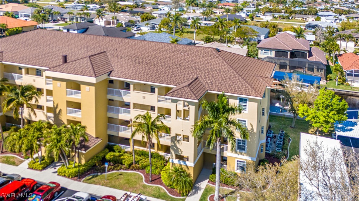 1799 Four Mile Cove Parkway, Unit 925 Cape Coral, FL 33990 - Photo 48 of 49 an aerial view of multiple houses