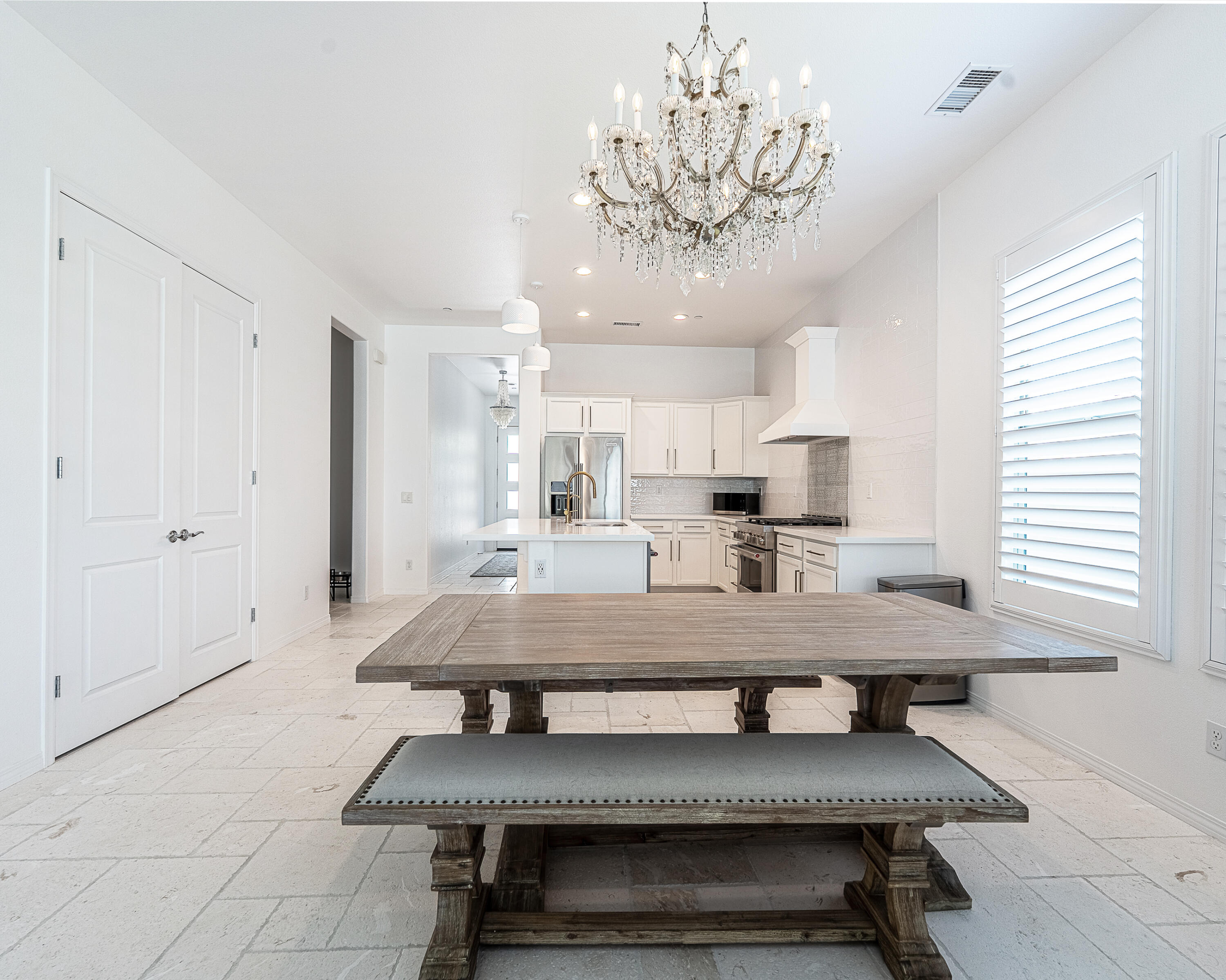 18 Vintage Rancho Mirage, CA 92270 - Photo 17 of 54 a large kitchen with a table and chairs in it