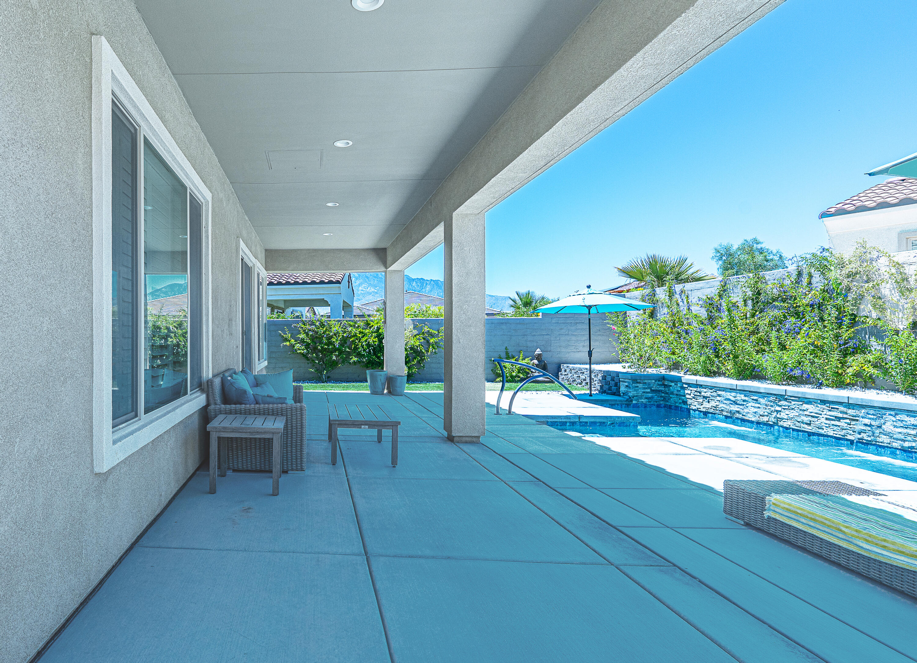 18 Vintage Rancho Mirage, CA 92270 - Photo 37 of 54 a view of a patio with couches table and chairs and potted plants