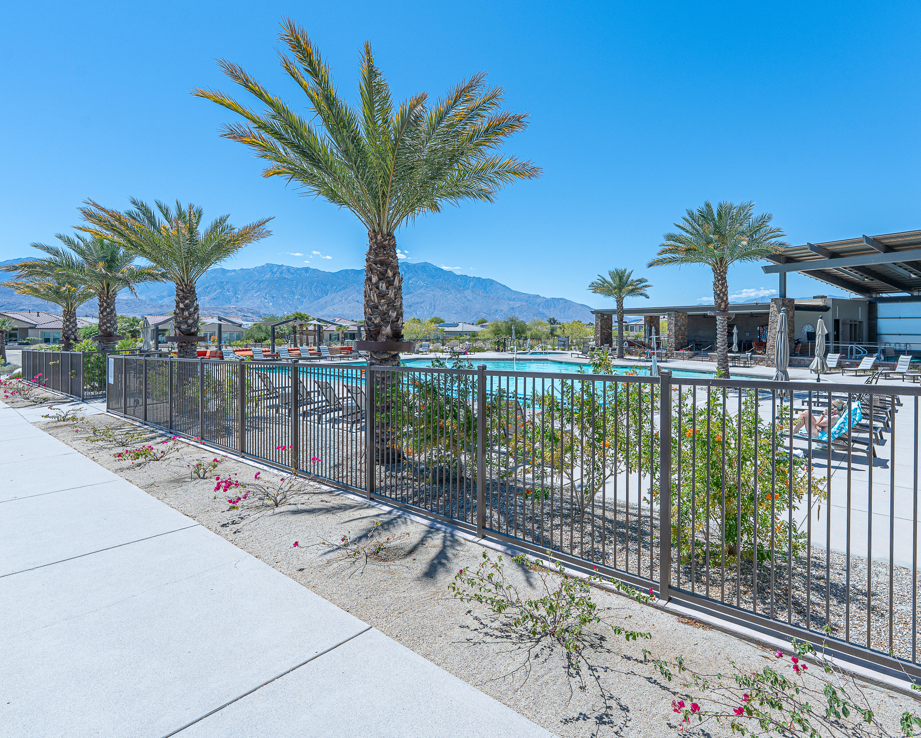 18 Vintage Rancho Mirage, CA 92270 - Photo 51 of 54 a view of a house with large windows and a lake view