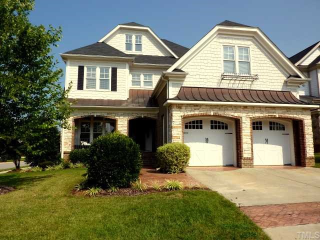 3201 Canes Way Raleigh, NC 27614 - Photo 1 of 11 a front view of a house with a yard and garage