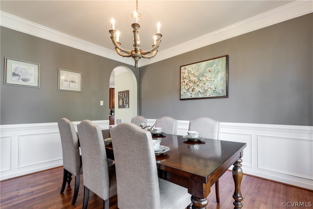 9518 Dunroming Road Chesterfield, VA 23832 - Photo 7 of 47 a view of a dining room with furniture wooden floor and chandelier