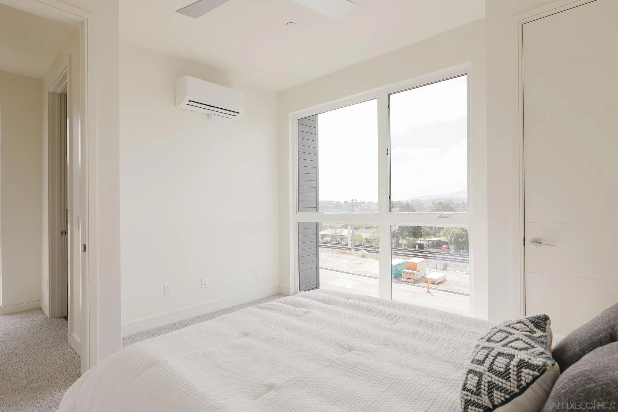 8286 High Street La Mesa, CA 91941 - Photo 15 of 27 a bedroom with a bed and a large window