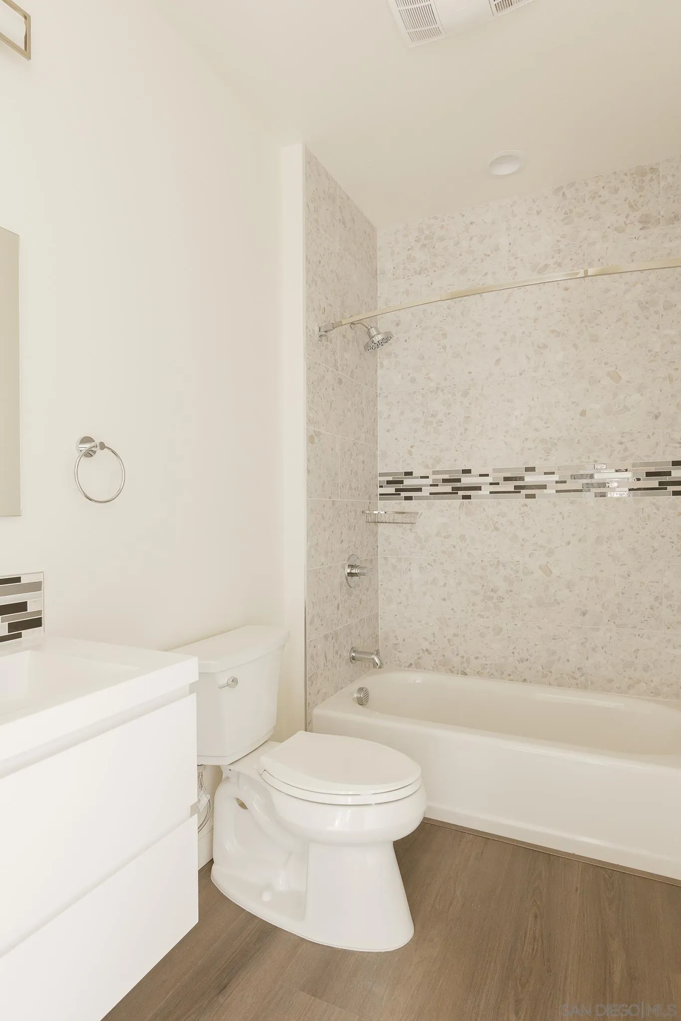8286 High Street La Mesa, CA 91941 - Photo 16 of 27 a bathroom with a white toilet sitting next to a bath tub